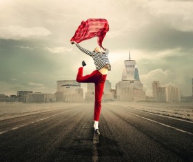 Woman jumping on the road Stock Photo