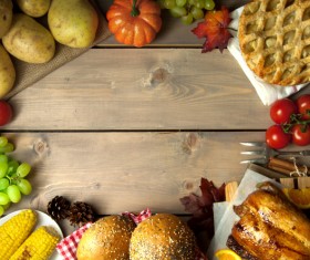 Wooden table filled with all kinds of food Stock Photo