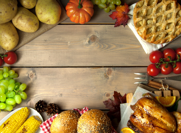 Wooden table filled with all kinds of food Stock Photo