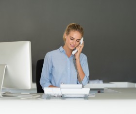 Young and beautiful front desk lady Stock Photo