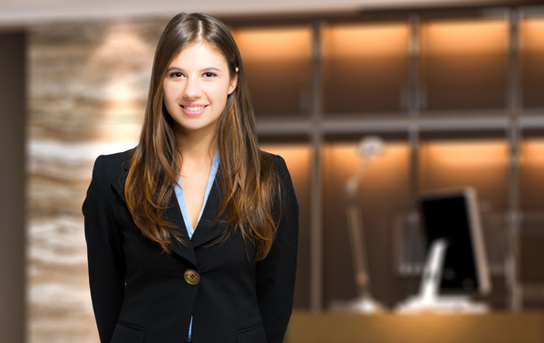 Young beautiful lobby receptionist Stock Photo