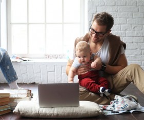 Young father holding baby Stock Photo