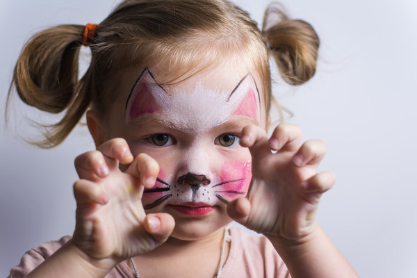 little girl dressed as kitten Stock Photo