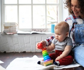 young mother playing with baby Stock Photo