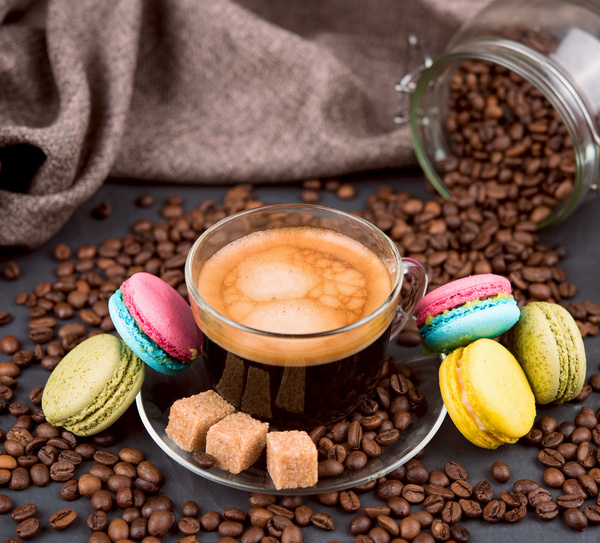 A cup of aromatic coffee and macarons Stock Photo