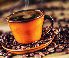 A cup of fragrant coffee and coffee beans Stock Photo 02