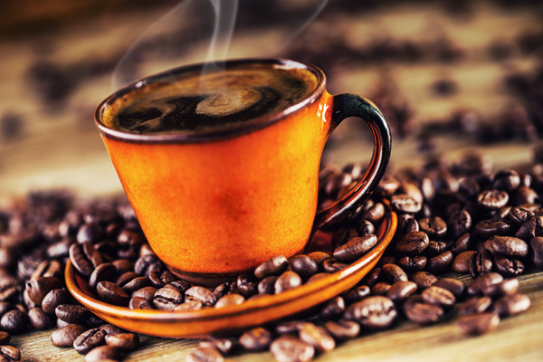 A cup of fragrant coffee and coffee beans Stock Photo 02