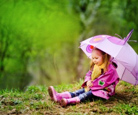 Adorable little girl with umbrella Stock Photo
