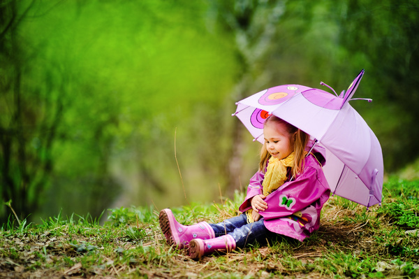 Adorable little girl with umbrella Stock Photo