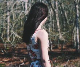 Attractive young woman posing in forest Stock Photo