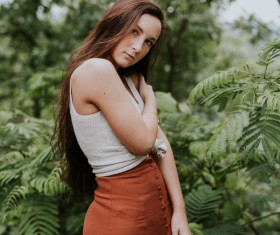 Attractive young woman posing in nature landscape Stock Photo