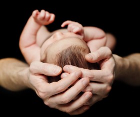 Baby in his hand Stock Photo
