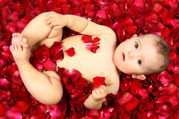Baby lying in flowers Stock Photo 03