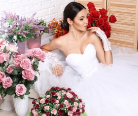 Beautiful bride in wedding dress posing among flowers Stock Photo 02