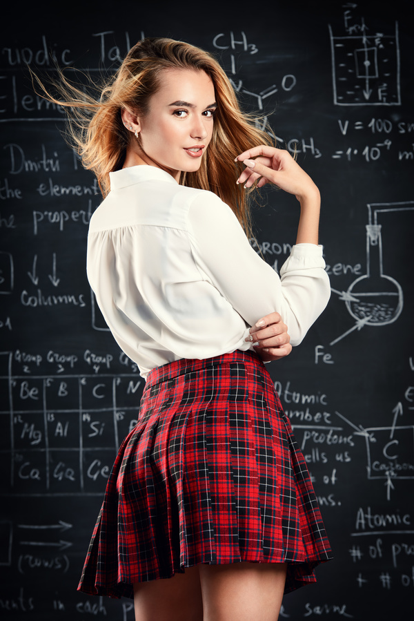 Beautiful college girl in front of blackboard Stock Photo 02