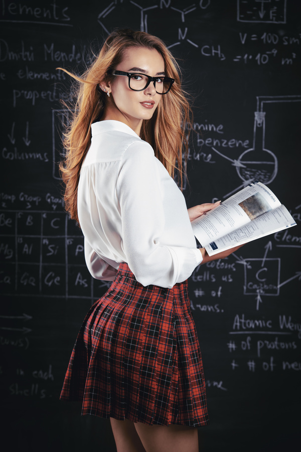 Beautiful college girl in front of blackboard Stock Photo 03