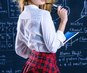 Beautiful college girl in front of blackboard Stock Photo 05