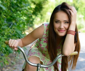 Beautiful girl riding bike Stock Photo
