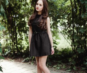 Beautiful young lady in black skirt Stock Photo