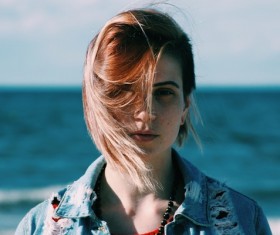 Beautiful young woman posing on beach Stock Photo