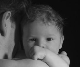 Black and white photo of father holding baby Stock Photo