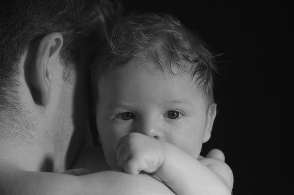 Black and white photo of father holding baby Stock Photo