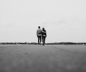 Black white picture of romantic couple on road Stock Photo