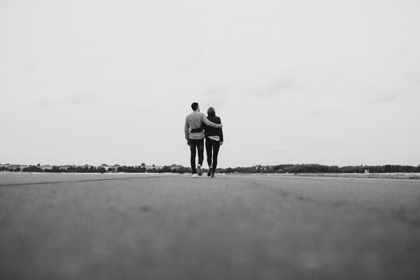 Black white picture of romantic couple on road Stock Photo