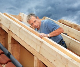 Carpenter building roof Stock Photo