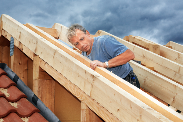 Carpenter building roof Stock Photo
