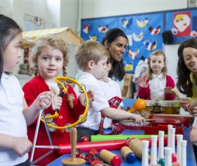 Children on music lessons Stock Photo
