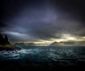 Cloudy sky and ripples on the beach Stock Photo