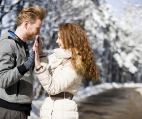 Couple having fun outdoors in winter Stock Photo 01