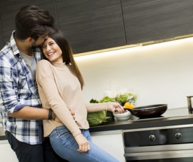 Couple hugging in the kitchen Stock Photo 02