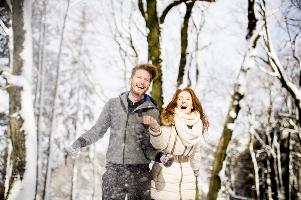 Couple playing with snow outdoor in winter Stock Photo 01