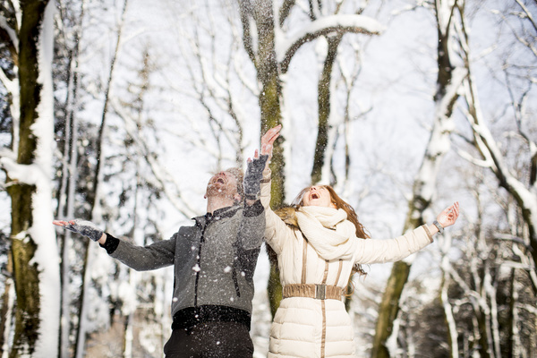 Couple playing with snow outdoor in winter Stock Photo 03