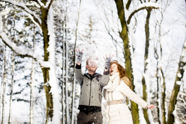 Couple playing with snow outdoor in winter Stock Photo 04
