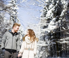 Couple walking outdoors in winter day Stock Photo