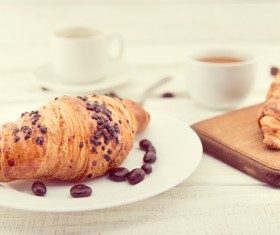 Croissants and chocolate beans in the plate Stock Photo