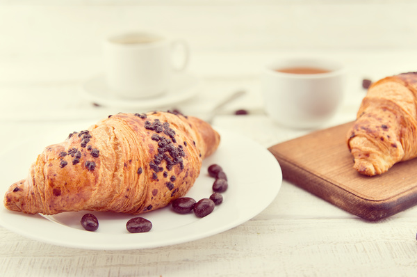 Croissants and chocolate beans in the plate Stock Photo