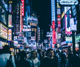 Crowded pedestrian walking in city at night Stock Photo