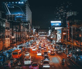 Crowded vehicles in busy city at night Stock Photo