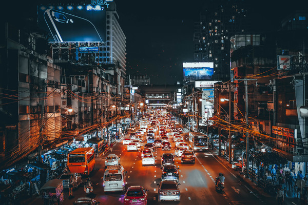 Crowded vehicles in busy city at night Stock Photo