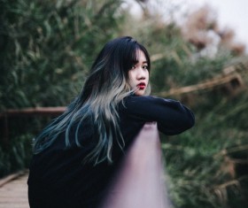 Cute young girl posing on bridge Stock Photo