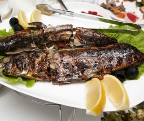 Delicious lemon roasted fish Stock Photo
