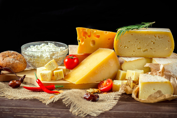 Different sorts of cheese on wooden table Stock Photo 02