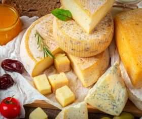 Different sorts of cheese on wooden table Stock Photo 03
