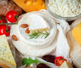 Different sorts of cheese on wooden table Stock Photo 04