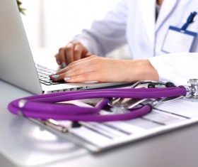 Doctor using laptop Stock Photo 02