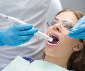 Doctors treat patients dental problems Stock Photo